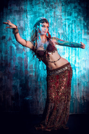 Art portrait of a beautiful traditional female dancer. の写真素材