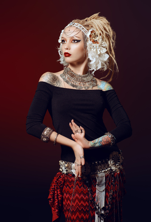 Studio shot of a beautiful traditional female dancer.の写真素材