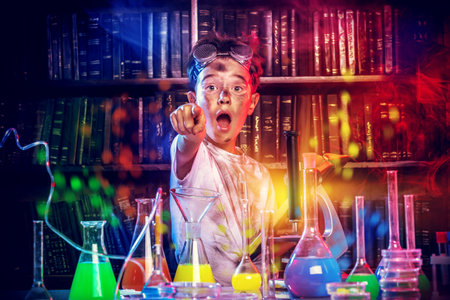 A boy doing experiments in the laboratory. Explosion in the laboratoryの写真素材