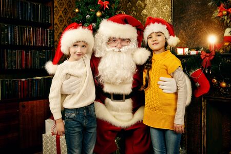 Santa Claus brought gifts for children. Christmas scene.の写真素材