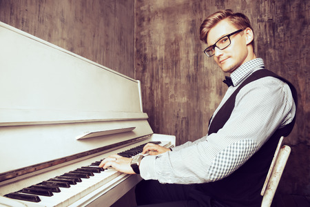 Pianist plays the pianoの写真素材