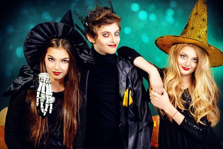 Children at the Halloween party in Traditional costumes and pumpkins decorationの写真素材