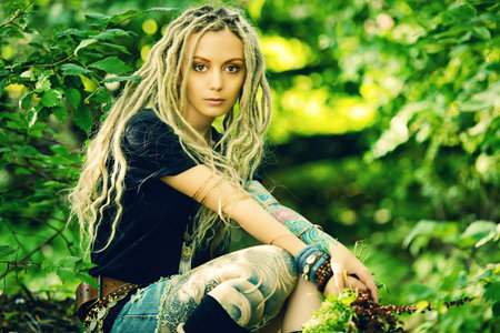 Romantic boho style girl in the wild wood. Boho, hippie fashion shot.