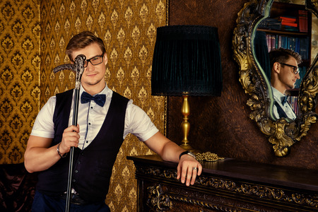 Successful handsome young man in classic vintage apartments. Fashion. Luxury.の写真素材