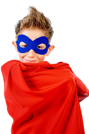 A boy teenager in a costume of superhero. Isolated over white background.の写真素材