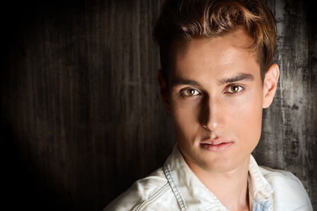 Close-up portrait of a handsome young man. Men's beauty, fashion. Studio shot.の写真素材