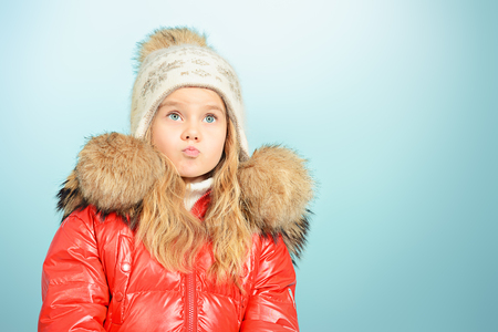 Pretty little girl in winter clothing.の写真素材