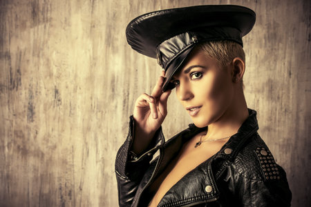 Attractive young woman alluring in a costume of police officer.