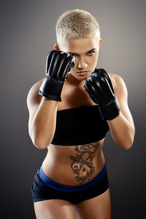 Portrait of a professional athlete woman bodybuilder with a perfect athletic physique.の写真素材