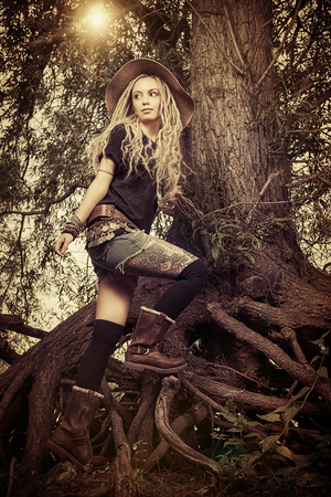 Beautiful boho style girl in the wild wood.の写真素材