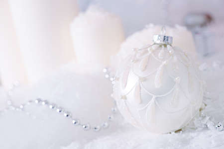 Christmas background: beautiful christmas ball in the snow.の写真素材