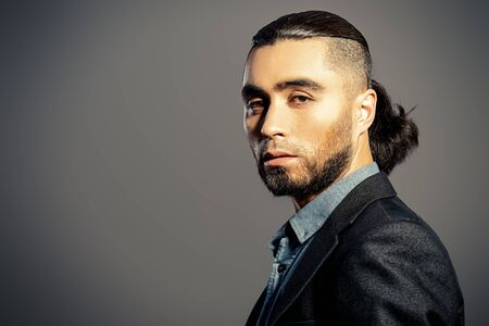 Portrait of a fashionable man in suit.の写真素材