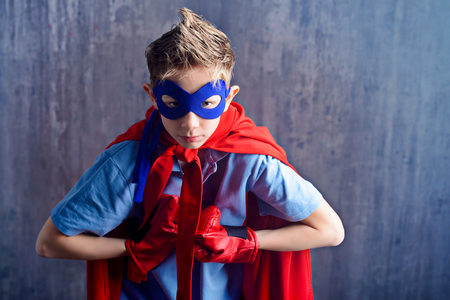 A boy teenager in a costume of superhero.の写真素材