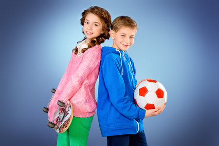 Modern teenagers posing together. Active generation. Studio shot.の写真素材