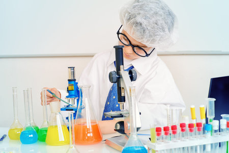 A boy concentrated working in the laboratory. Science and education. School.