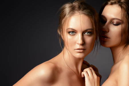 Portrait of two beautiful sensual women.