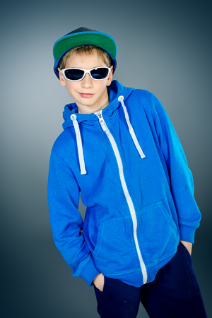 Portrait of a smiling teen boy. Studio shot.の写真素材