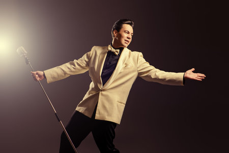Handsome male singer, who plays in the style of the sixties. Rock'n'roll, jazz man. Nostalgia.
