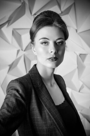 Portrait of a beautiful business lady wearing formal suit. Business style, fashion. Toned photo, sepia.の写真素材