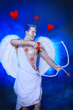 Male angel Cupid with a bow and arrows of love. Valentine's day. Love concept.の写真素材