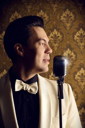 Handsome male singer, who plays in the style of the sixties. Rock'n'roll, jazz man. Nostalgia.