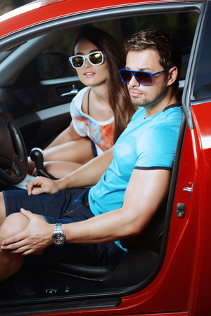 Portrait of a beautiful young people driving in the car.の写真素材