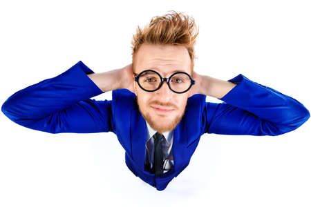 Funny smart guy in a suit and spectacles smiles into the camera. Isolated over white.の写真素材