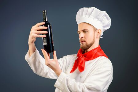 Male sommelier tasting red wine. Winemaking. Occupations.の写真素材