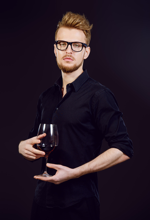 Male sommelier tasting red wine. Winemaking. Occupations.の写真素材