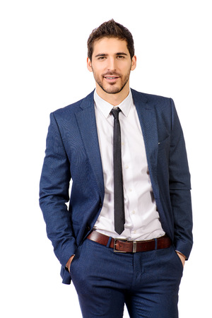 Fashion shot of a handsome man wearing elegant suit. Men's beauty, fashion. Isolated over white.の写真素材