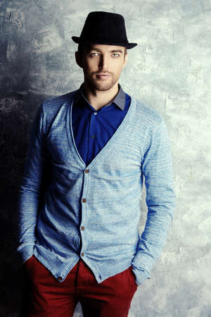 Elegant good looking young man in a hat.の写真素材