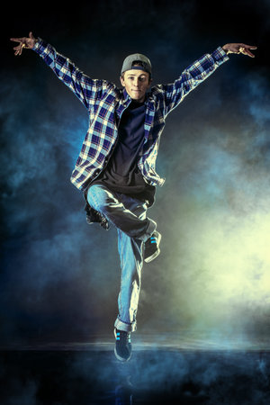 Modern young man dancer dancing at studio.