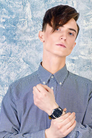 Portrait of a young man with fashionable hairstyle.の写真素材