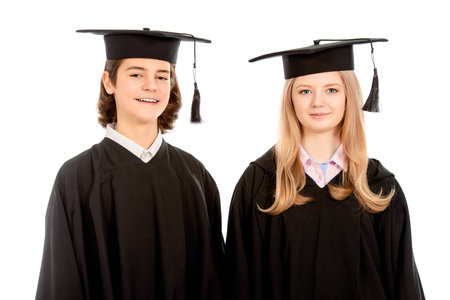 Portrait of two happy graduating students. Isolated over white background.の写真素材