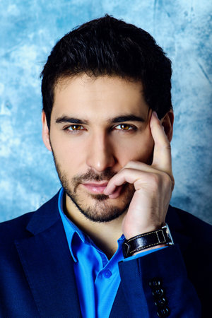 Fashion shot of a handsome man wearing elegant suit. Men's beauty, fashion. Businessman.の写真素材