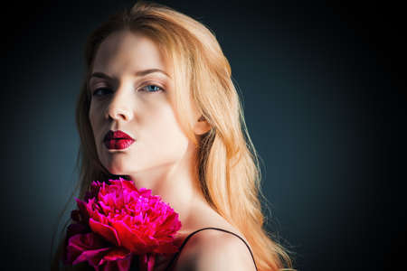 Portrait of a gorgeous blonde woman with sensual maroon lips. Beauty, fashion. Make-up, cosmetics.の写真素材