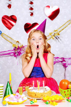 Beautiful little girl enjoys her birthday. Celebration, life events. Happy birthday.の写真素材