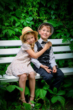 Romantic children at a park. Retro style.の写真素材