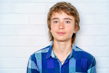 Portrait of a modern teenage boy. Studio shot. Youth culture.の写真素材