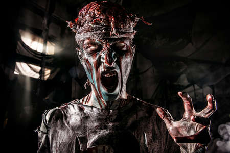 Bloody zombie man with brains out. Horror. Halloween.の写真素材