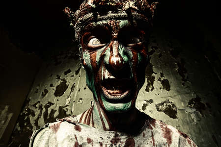 Bloody zombie man with brains out. Horror. Halloween.の写真素材
