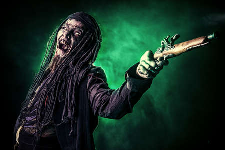 Fantasy pirate, risen from the dead. Pirate zombie in hell green light. Halloween.の写真素材