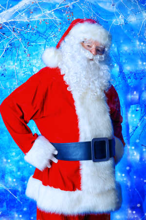 Portrait of Santa Claus in a winter magic forest. Christmas time.の写真素材