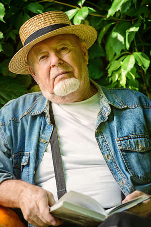 Portrait of a handsome senior man having a rest on a sunny summer day. Healthcare, resort. Happy retirement.の写真素材