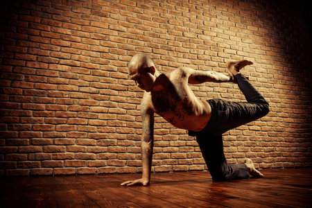 Various difficult yoga poses. Yoga teacher doing exercises on yoga.の写真素材