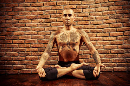 Lotus pose. Yoga master practicing yoga. Meditation, concentration.の写真素材