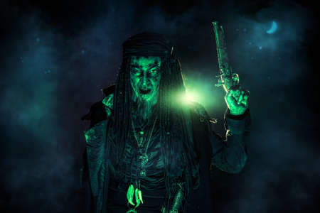 Fantasy pirate, risen from the dead. Pirate zombie in hell green light. Halloween.の写真素材