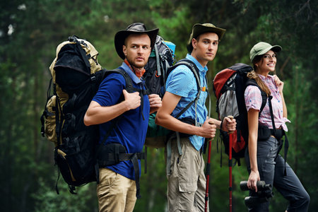 Adventure and hiking. Group of young people make a hike in mountains. Active lifestyle. Tourist...