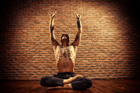 Lotus pose. Yoga master practicing yoga. Meditation, concentration.の写真素材