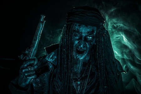 Fantasy pirate, risen from the dead. Pirate zombie in hell green light. Halloween.の写真素材